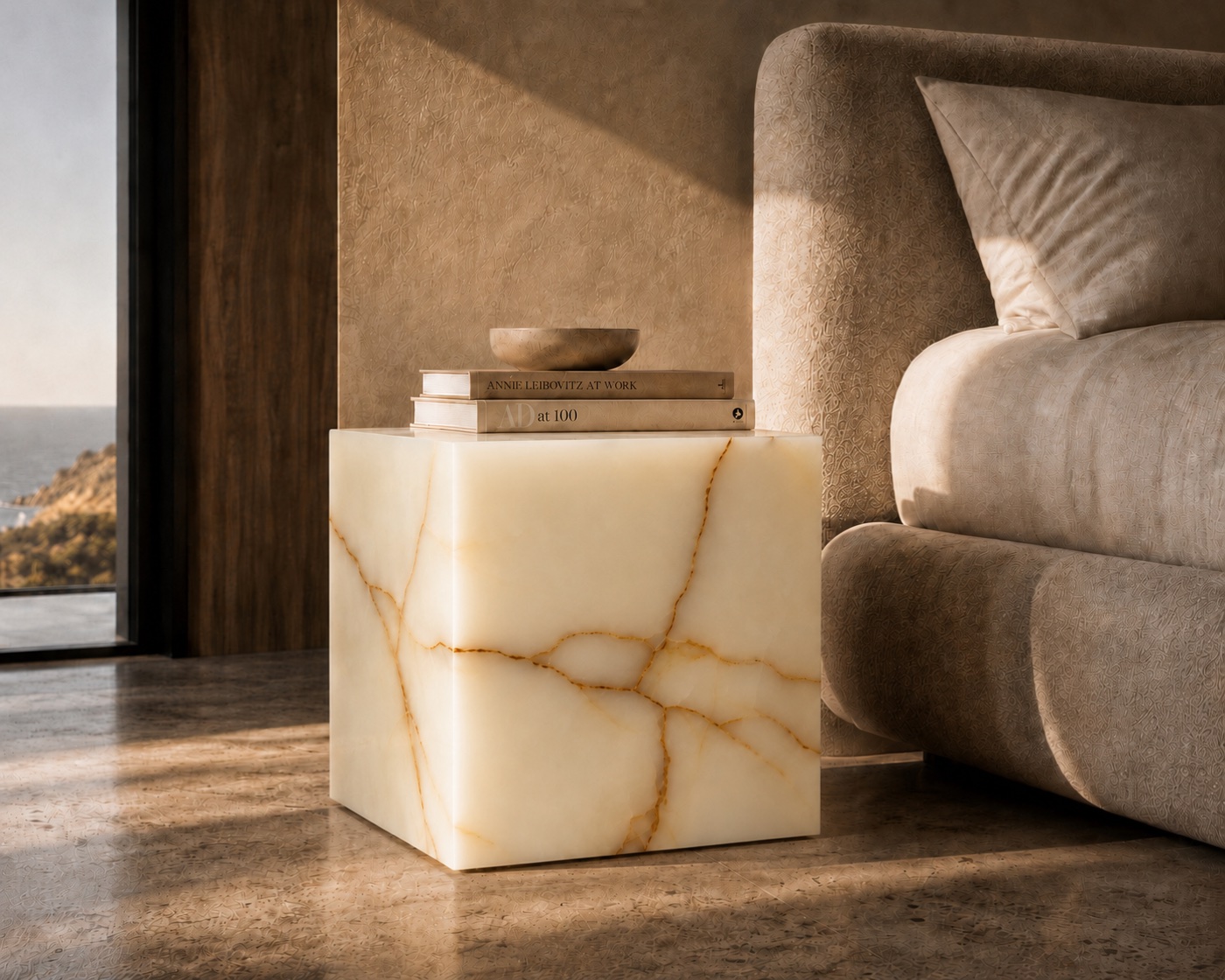 White Onyx Illuminated Table styled as a bedside cube beside a bed